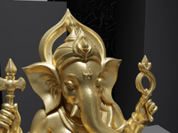 Ganesh murti statue in gold, close detail of the face and hands